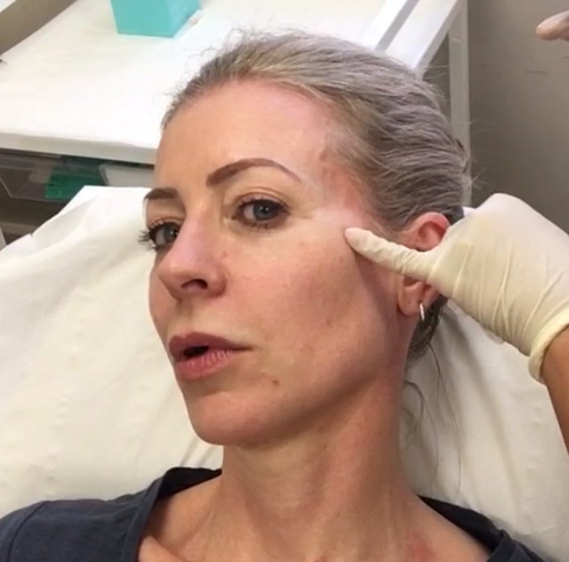 face and gloved hand